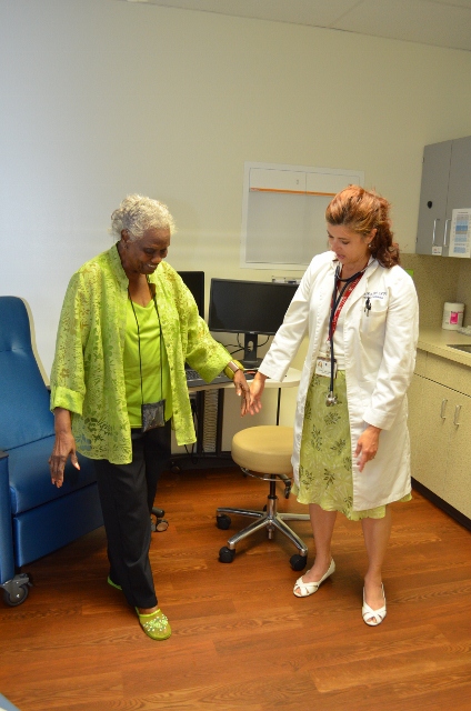 UTMB's Andrea Wirt assesses Ellisor's ability to maintain balance while walking 